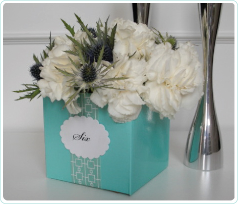 4" cube in aqua marine used as the table number holder