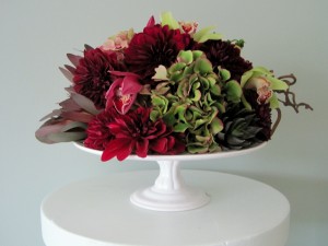 AK Haydon Floral Designs Cake plate filled with hydrangeas, succulents, cymbidiums and dahlias.