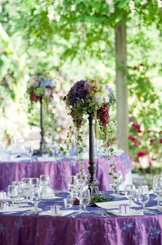 tall centerpieces with hydrangea and grapes