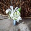 Michigan wedding florist boutonniere white nerine star of beth gray suits